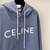 Moletom Celine Hoodie "Blue": Moletom azul da Celine, uma peça de vestuário casual e elegante com capuz, perfeito para um visual descontraído e moderno.