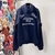 Christian Dior Atelier Paris Avenue Montaigne "Dark Blue" Sweatshirt: A dark blue sweatshirt with Christian Dior's "Atelier Paris Avenue Montaigne" logo, perfect for an urban and elegant style.