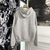 Dior CD Icon Hoodie "Gray": Dior gray sweatshirt with the emblematic "CD" logo on the chest, providing a modern and comfortable look for various occasions.