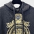 Moletom Versace Hoodie Barocco Print Black: Moletom preto com estampa barroca da Versace, conferindo um visual luxuoso e elegante para um estilo casual e sofisticado.