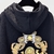 Versace Seashell Baroque Black Sweatshirt: Black sweatshirt with baroque seashell pattern from Versace, adding a touch of sophistication and luxurious style to the casual look.