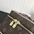 A Louis Vuitton Nano Toiletry Pouch toiletry bag with the brand's Monogram Canvas pattern. This small accessory is perfect for storing personal hygiene items in a compact and elegant way. With its classic and durable design, it is a practical and stylish 