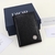 Dior Two-Fold CD Icon Leather Black Card Holder: An elegant card holder from Dior in black leather with the iconic CD pattern, perfect for storing your cards with style and sophistication.