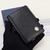 Dior Two-Fold CD Icon Leather Black Card Holder: An elegant card holder from Dior in black leather with the iconic CD pattern, perfect for storing your cards with style and sophistication.