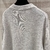 Christian Dior Couture "Gray" Pullover: A gray pullover from Christian Dior Couture, elegant and sophisticated, for a chic and modern look on colder days.