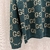 Gucci GG Wool Jacquard Jumper "Green" Sweater: A green sweater from Gucci with a GG jacquard pattern in wool for a sophisticated and distinctive style on colder days.