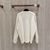 Loewe With Engraved Anagram "Beige" Sweater: A beige sweater from Loewe with the iconic anagram engraved for sophisticated, modern style in every season.