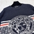 Versace Wool With La Greca Medusa "Dark Blue" Sweater: A Versace wool sweater in dark blue, with a La Greca pattern and detail of the iconic Medusa, conveying elegance and refined style.