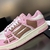 Amiri Skel "Pink/Brown/White" sneakers: Pink shoes with brown and white details, a modern style from the Amiri brand.