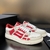 Amiri Skel "Red/White/Beige" sneakers: Red shoes with white and beige details, a modern style from the Amiri brand.