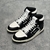 Amiri Skel Top Hi "Black/White" Sneakers: Black high shoes with white details, modern design from the Amiri brand.