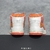 Amiri Skel Top Hi "White/Orange" Sneakers: White high shoes with orange details, modern design from the Amiri brand.