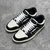 Amiri Skel Top Low "Black/White" Sneakers: Black low shoes with white details, modern design from the Amiri brand.