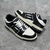 Amiri Skel Top Low "Black/White" Sneakers: Black low shoes with white details, modern design from the Amiri brand.