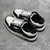 Amiri Skel Top Low "Black/White" Sneakers: Black low shoes with white details, modern design from the Amiri brand.