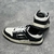 Amiri Skel Top Low "Black/White" Sneakers: Black low shoes with white details, modern design from the Amiri brand.