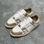 Amiri Skel Top Low "Brown/White" Sneakers: Brown low shoes with white details, modern design from the Amiri brand.