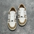 Amiri Skel Top Low "Brown/White" Sneakers: Brown low shoes with white details, modern design from the Amiri brand.