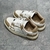 Amiri Skel Top Low "Brown/White" Sneakers: Brown low shoes with white details, modern design from the Amiri brand.