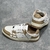 Amiri Skel Top Low "Brown/White" Sneakers: Brown low shoes with white details, modern design from the Amiri brand.