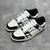 Amiri Skel Top Low "White/Black" Sneakers: White low shoes with black details, modern design from the Amiri brand.