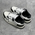 Amiri Skel Top Low "White/Black" Sneakers: White low shoes with black details, modern design from the Amiri brand.