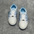 Amiri Skel Top Low "White/Light Blue" Sneakers: White low shoes with light blue details, modern design from the Amiri brand.