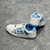 Amiri Skel Top Low "White/Light Blue" Sneakers: White low shoes with light blue details, modern design from the Amiri brand.