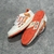 Amiri Skel Top Low "White/Orange" Sneakers: White low shoes with orange details, modern design from the Amiri brand.