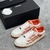 Amiri Skel Top Low "White/Orange" Sneakers: White low shoes with orange details, modern design from the Amiri brand.