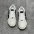 Amiri Stars Court Low "White/Black" Sneakers: White low shoes with black details, modern design from the Amiri brand.