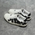 Amiri Stars Court Low "White/Black" Sneakers: White low shoes with black details, modern design from the Amiri brand.