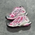 Pink/White Balenciaga Runner Sneakers: A pair of Balenciaga sneakers with a predominance of pink and white details, creating a modern and feminine style.