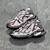 Balenciaga Runner Silver/Wine Sneakers: A pair of Balenciaga sneakers with burgundy details on a silver background, offering a sleek, modern touch to your look.