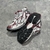 Balenciaga Runner Silver/Wine Sneakers: A pair of Balenciaga sneakers with burgundy details on a silver background, offering a sleek, modern touch to your look.