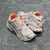 Balenciaga Runner White/Orange Sneakers: A pair of Balenciaga sneakers with orange details on a white background, perfect for a sporty and modern look.