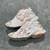 Balenciaga Runner White/Orange Sneakers: A pair of Balenciaga sneakers with orange details on a white background, perfect for a sporty and modern look.