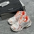 Balenciaga Runner White/Orange Sneakers: A pair of Balenciaga sneakers with orange details on a white background, perfect for a sporty and modern look.