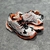 Balenciaga Runner White/Orange/Black Sneakers: A pair of Balenciaga sneakers with a white, orange and black color combination, designed for a sporty and modern style.