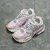 Balenciaga Runner White/Pink Sneakers: A pair of Balenciaga sneakers with pink accents on a white background, providing a sleek, modern look for any occasion.