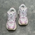 Balenciaga Runner White/Pink Sneakers: A pair of Balenciaga sneakers with pink accents on a white background, providing a sleek, modern look for any occasion.