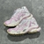 Balenciaga Runner White/Pink Sneakers: A pair of Balenciaga sneakers with pink accents on a white background, providing a sleek, modern look for any occasion.