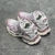 Balenciaga Runner White/Pink Sneakers: A pair of Balenciaga sneakers with pink accents on a white background, providing a sleek, modern look for any occasion.