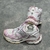 Balenciaga Runner White/Pink Sneakers: A pair of Balenciaga sneakers with pink accents on a white background, providing a sleek, modern look for any occasion.