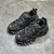 Balenciaga Track "Black" Sneakers: Black sports shoe, modern design from the renowned Balenciaga brand.