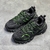 Balenciaga Track "Black/Green" sneakers: Sports shoe with a predominance of black and green details, modern design from the Balenciaga brand.