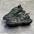 Tênis Balenciaga Track "Black/Green": Sapato esportivo com predominância de preto e detalhes verdes, design moderno da marca Balenciaga.