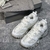 Balenciaga Track "White" Sneakers: White sports shoe, with modern design and innovative details from the Balenciaga brand.