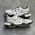 Balenciaga Track "White/Beige/Black" Sneakers: Sports shoe with a combination of white, beige and black, modern design from the Balenciaga brand.