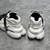 Balmain Unicorn "White/Black" sneakers: White shoes with black details, from Balmain's Unicorn line, elegant and modern.